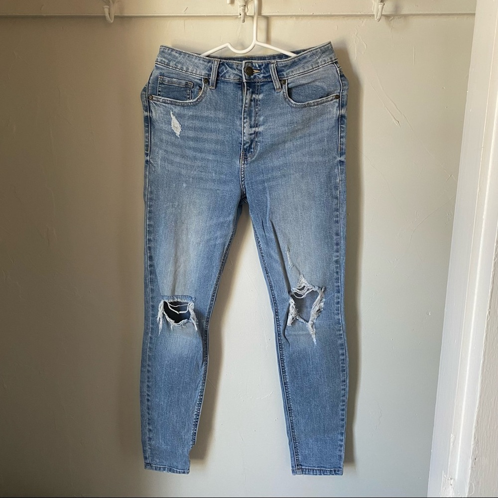 Light wash distressed skinny jeans